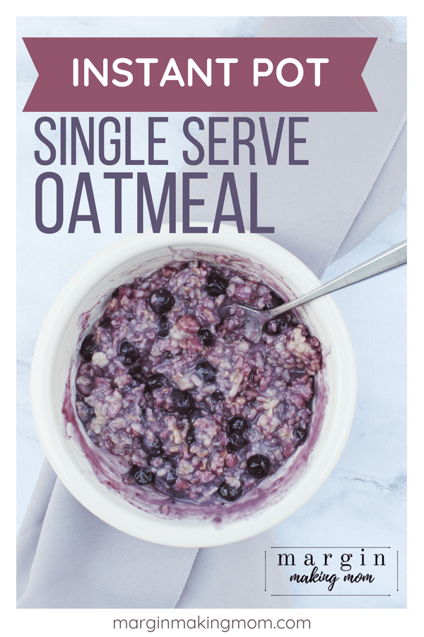 white bowl filled with instant pot oatmeal with blueberries mixed in