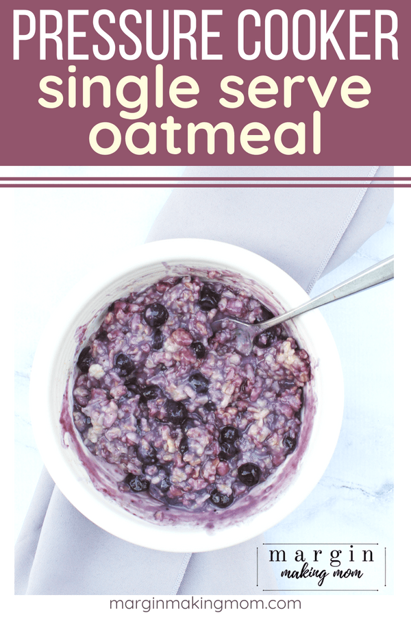 White bowl full of Instant Pot oatmeal with blueberries mixed in