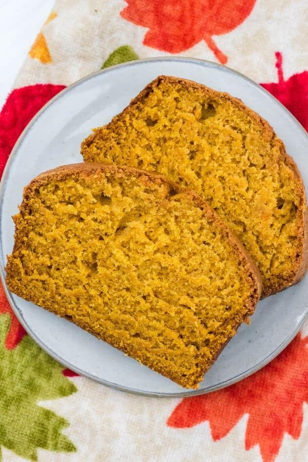 two slices of pumpkin bread on a white plate