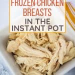 white bowl filled with shredded chicken made from frozen chicken breasts in the Instant Pot