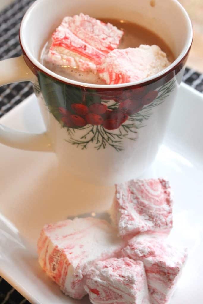 These peppermint swirl marshmallows are a pretty and tasty way to dress up a cup of cocoa or coffee! They also make a lovely inexpensive handmade gift! They only require a handful of ingredients and no corn syrup!