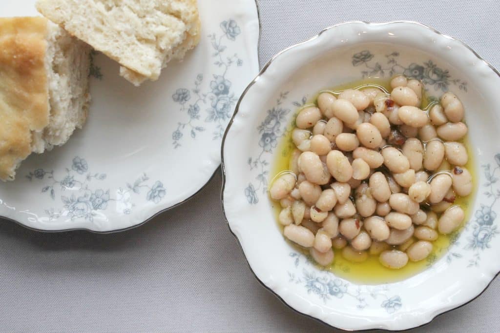 This irresistible Italian white bean dip is just as good as the version at Supper NYC! A super simple appetizer guaranteed to please. Click through to learn how to make it!