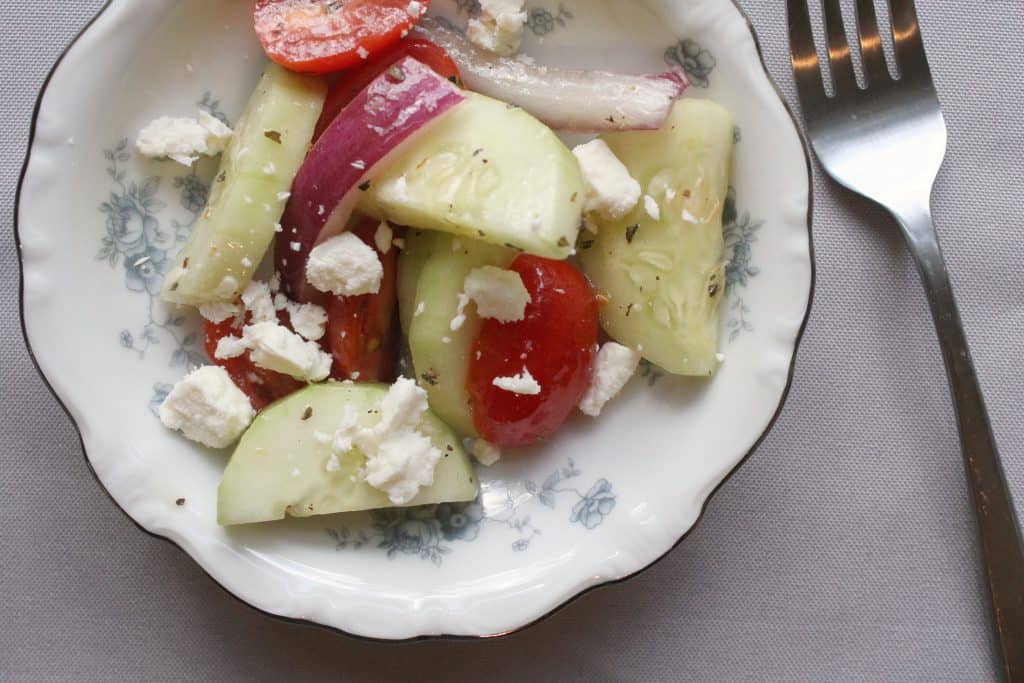 This deliciously simple cucumber salad is a wonderful way to utilize summer's bounty of produce! It's a frugal and easy side item that is sure to please. Click through to learn how to make it!