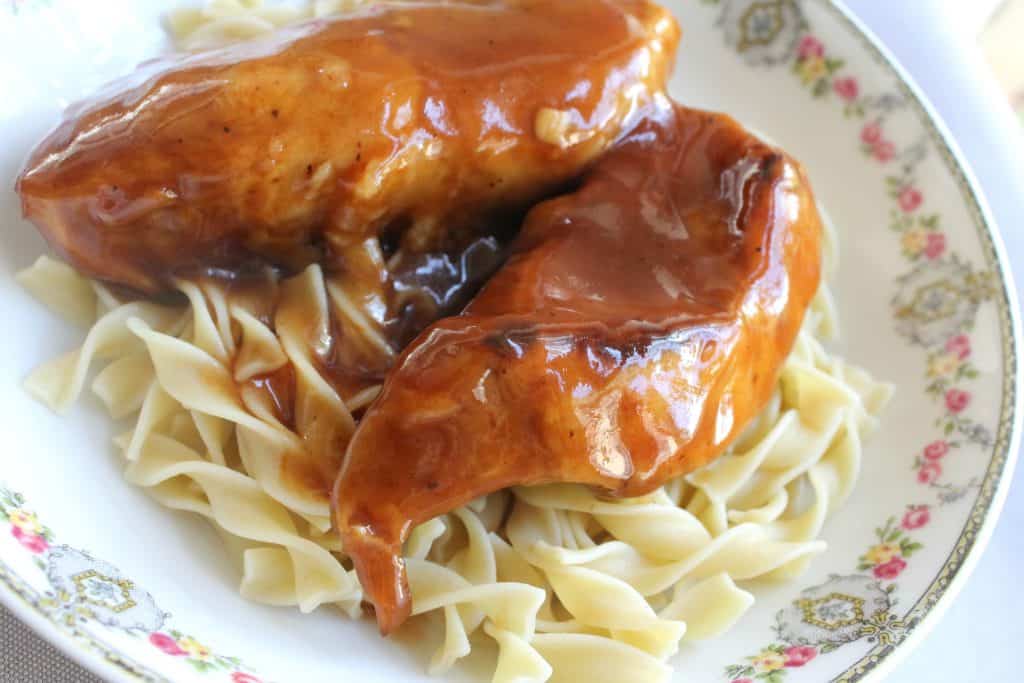 instant pot bbq ribs on a bed of egg noodles