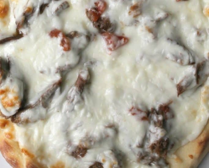 These spicy beef flatbread pizzas are made easy by using the pressure cooker to cook tender, flavorful beef in a fraction of the normal time.