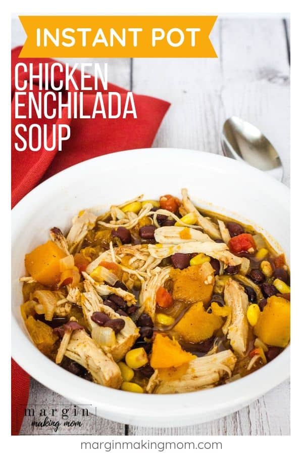 Instant Pot chicken and sweet potato enchilada soup in a white bowl