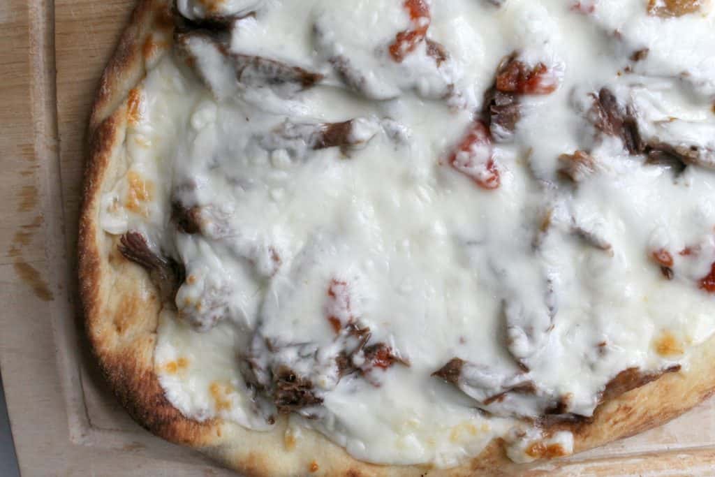 These spicy beef flatbread pizzas are made easy by using the pressure cooker to cook tender, flavorful beef in a fraction of the normal time.