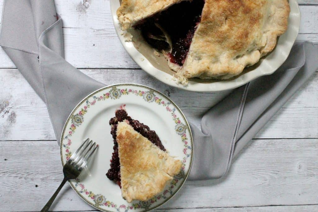 This deep dish blackberry pie is chock full of bursting berries--it's the perfect way to harness the sweetness of summer's berry bounty! 