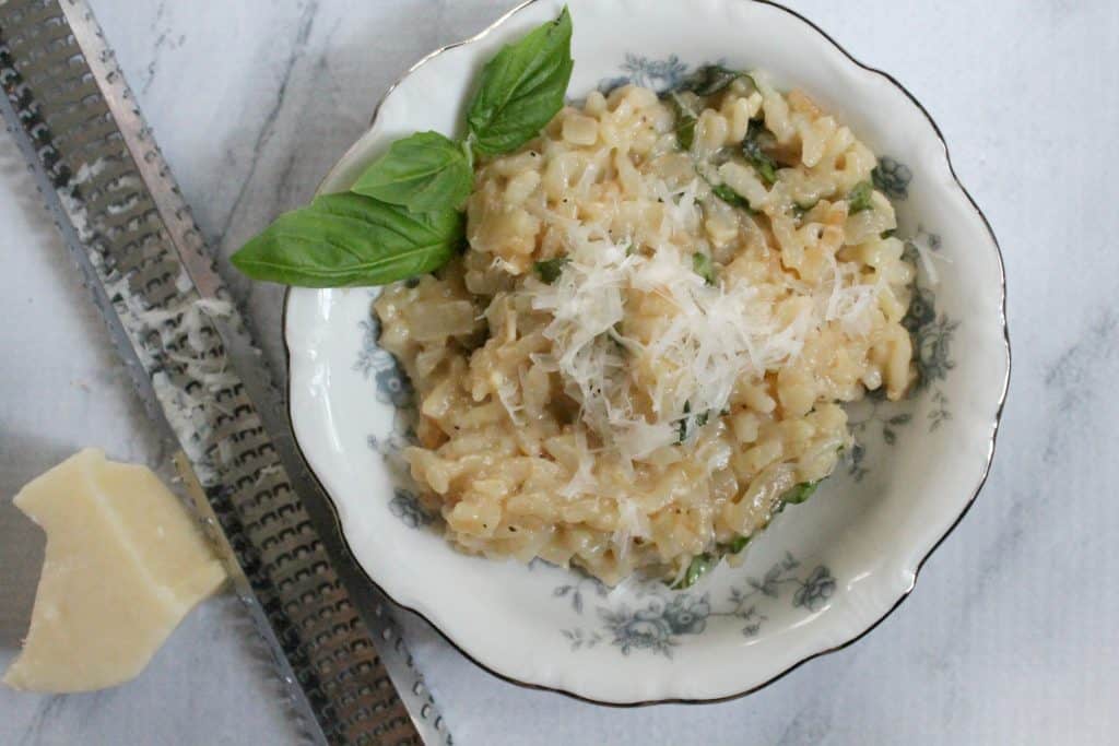 Making risotto in the Instant Pot pressure cooker saves a lot of time compared to the traditional method of preparation! It's creamy, easy, and delicious! Click through to learn how to easy it is!