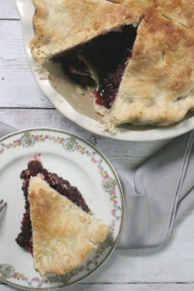 This deep dish blackberry pie is chock full of bursting berries--it's the perfect way to harness the sweetness of summer's berry bounty!
