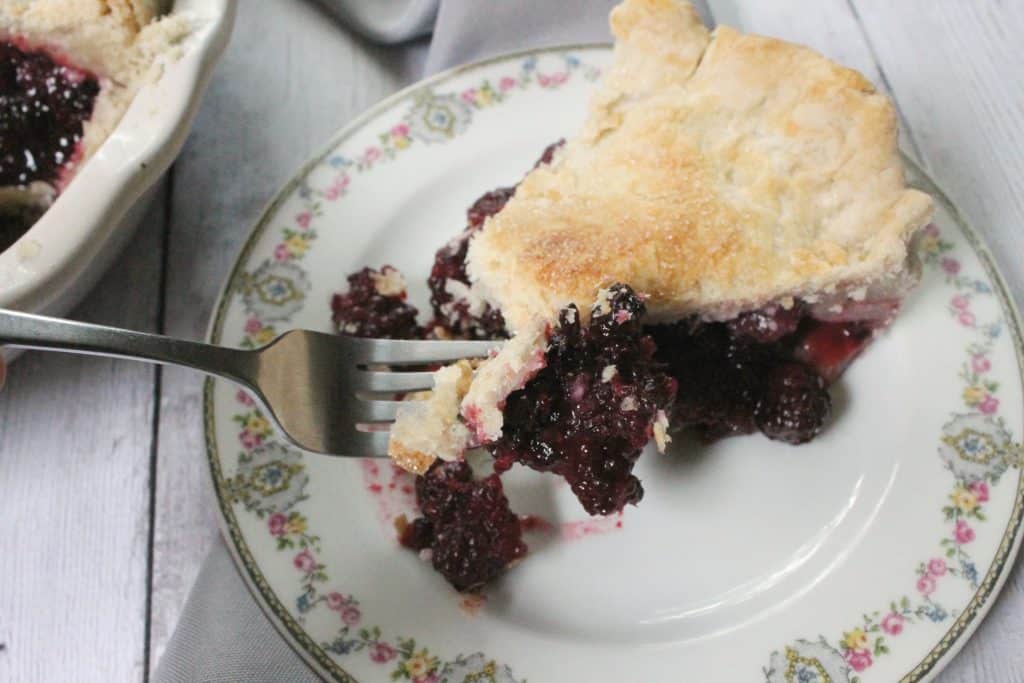 This deep dish blackberry pie is chock full of bursting berries--it's the perfect way to harness the sweetness of summer's berry bounty! 