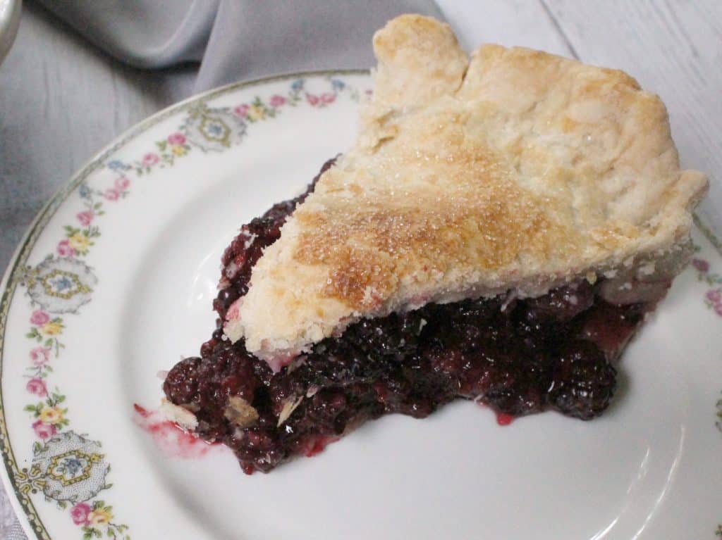 This deep dish blackberry pie is chock full of bursting berries--it's the perfect way to harness the sweetness of summer's berry bounty! 