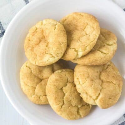 soft and chewy snickerdoodles on a white plate