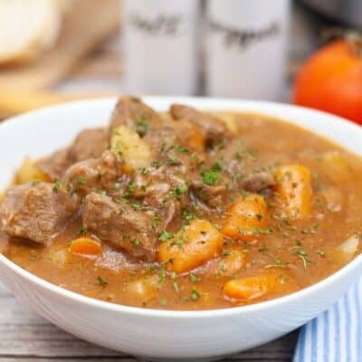 white bowl filled with pressure cooker beef stew prepared in the Instant Pot