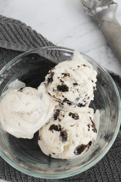 clear bowl with three scoops of cookies and cream ice cream