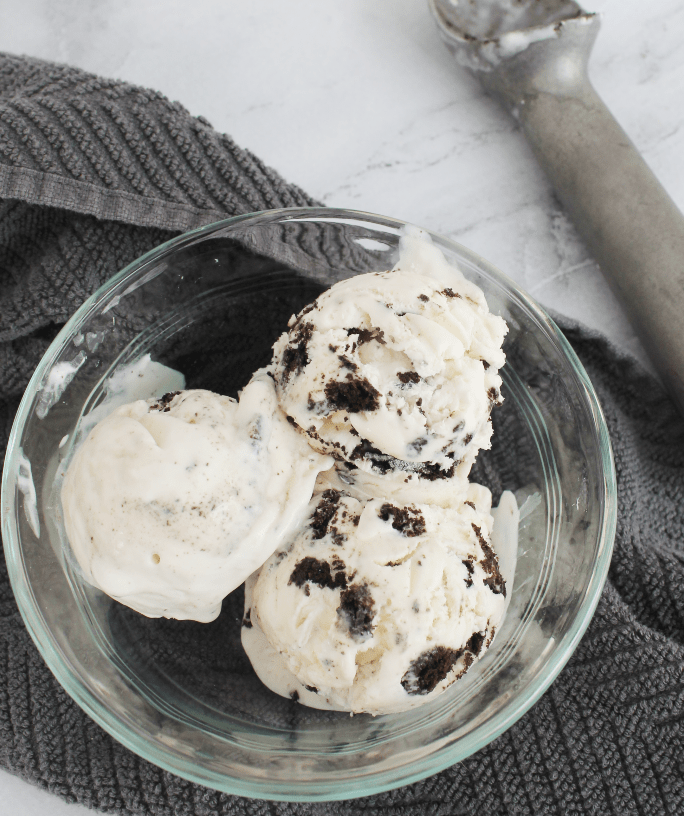 clear bowl with three scoops of cookies and cream ice cream