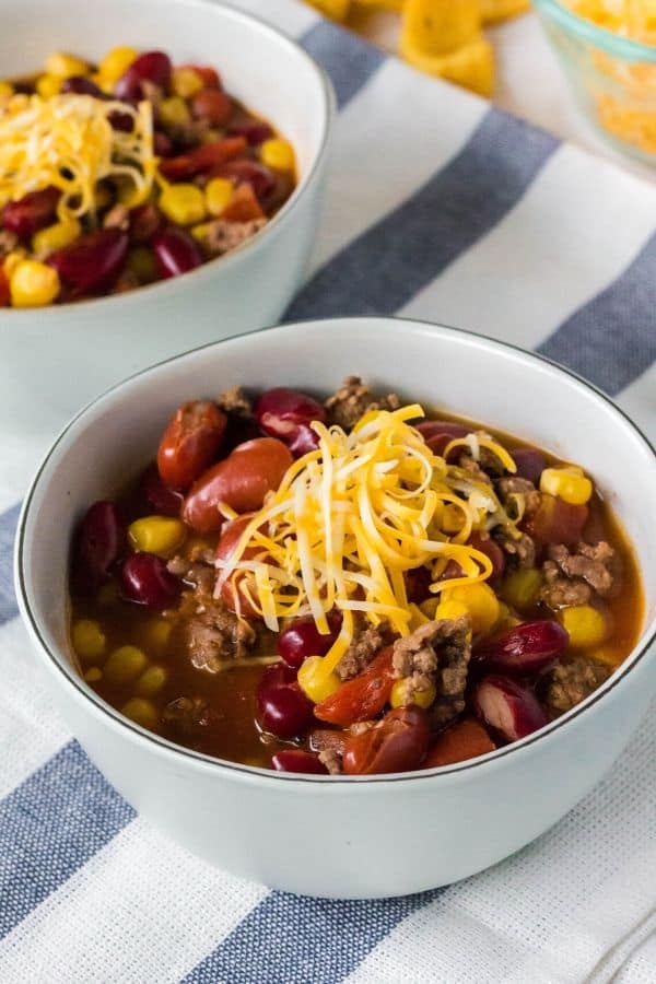 two white bowls filled with taco soup cooked in the Instant Pot pressure cooker