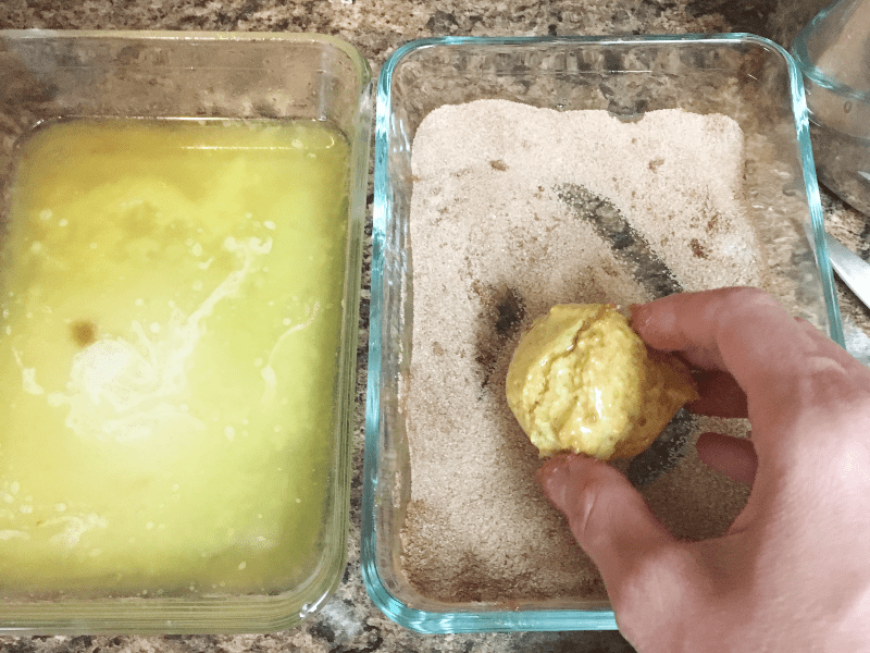 shallow glass dish with butter and shallow glass dish with cinnamon sugar in it