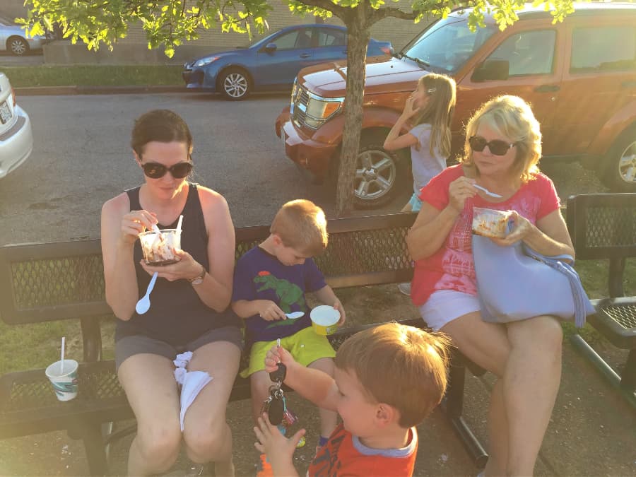 two women and two children eating ted drewe's frozen custard in st louis