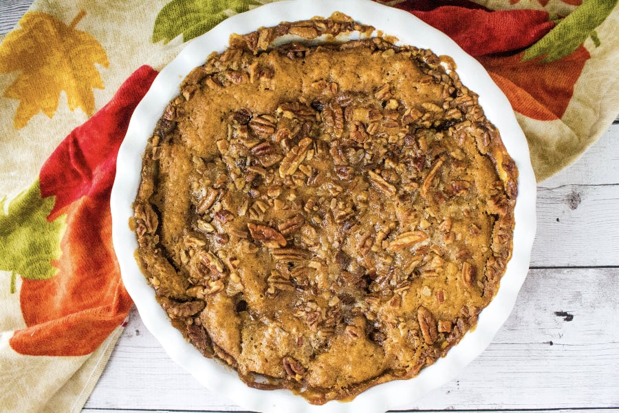 baked pumpkin cobbler topped with pecans