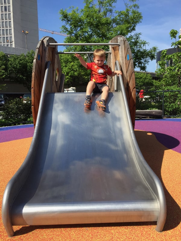 boy going down slide at kiener park