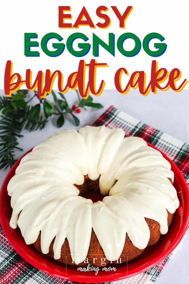 an eggnog bundt cake is served on a red plate, topped with eggnog cream cheese icing.