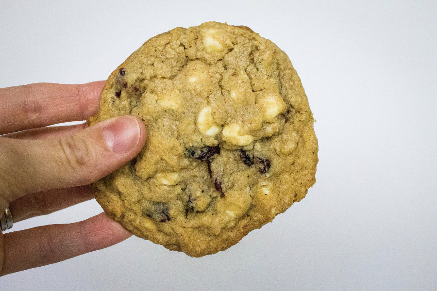 oatmeal cranberry white chocolate chip cookie in a hand