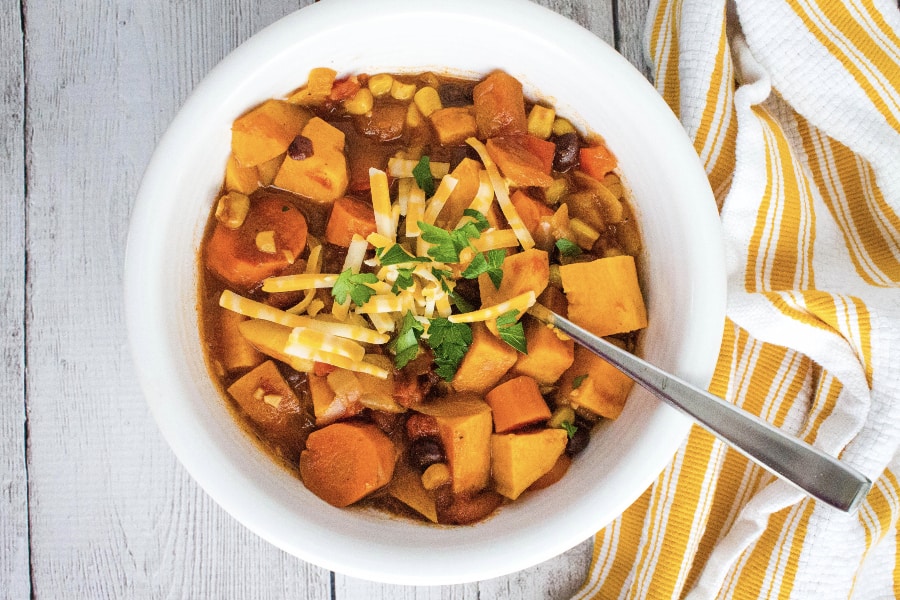 white bowl filled with delicious sweet potato chili cooked in the Instant Pot pressure cooker
