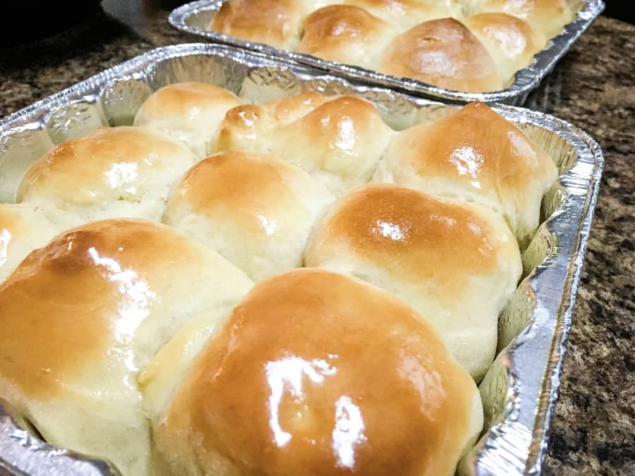 pans of Instant Pot dinner rolls made with dough that proofs in the Instant Pot