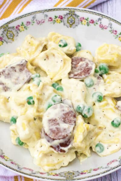 bowl filled with Instant Pot creamy tortellini and sausage