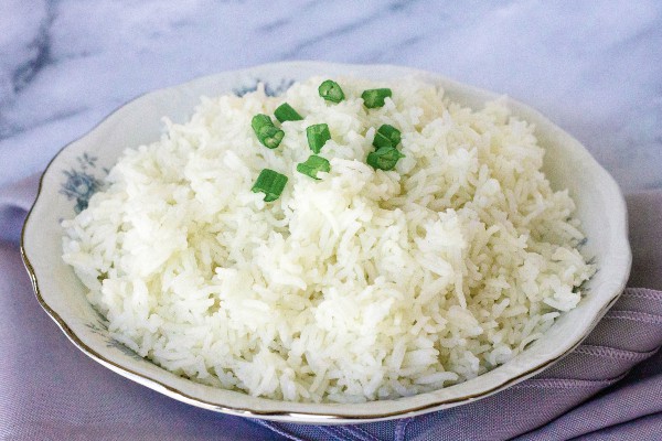 china bowl filled with basmati rice cooked in the Instant Pot