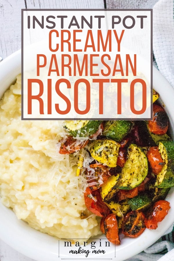 white bowl filled with parmesan risotto cooked in the Instant Pot, paired with roasted vegetables