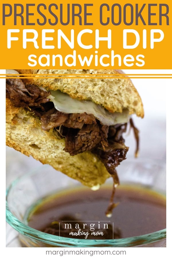 pressure cooker french dip sandwich being dipped into hot au jus