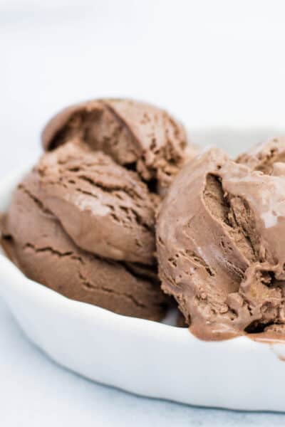 scoops of homemade no-churn chocolate peanut butter ice cream in a white dish