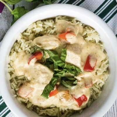 white bowl filled with rice and creamy Italian chicken cooked in the Instant Pot