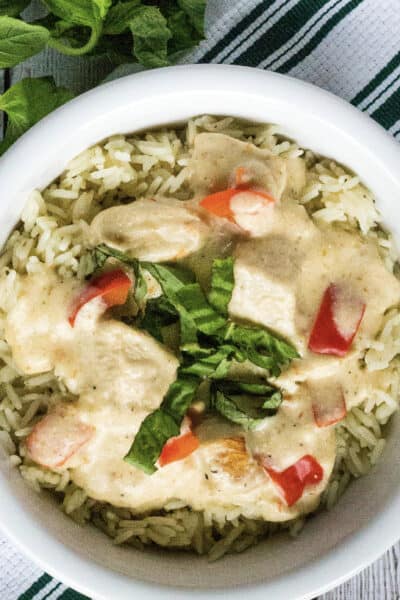 white bowl filled with rice and creamy Italian chicken cooked in the Instant Pot
