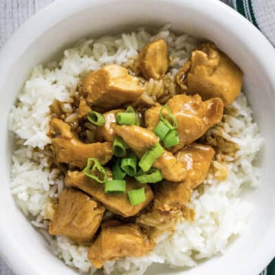 white bowl filled with Instant Pot sesame chicken and rice