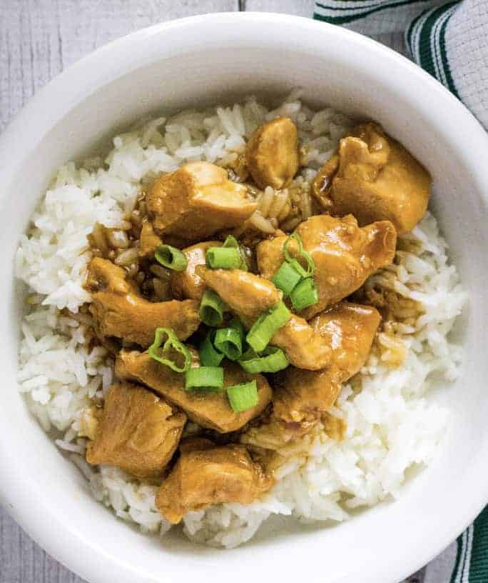 white bowl filled with Instant Pot sesame chicken and rice