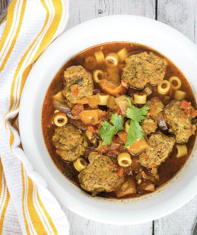 white bowl filled with Instant Pot albondigas soup