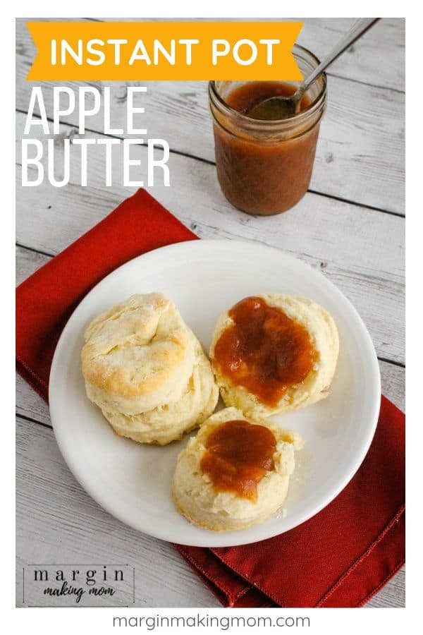 white plate with biscuits on it, topped with apple butter cooked in the Instant Pot