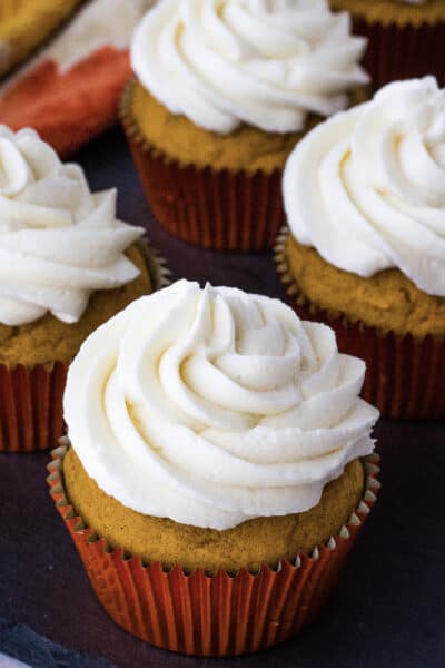 moist pumpkin cupcakes topped with boiled milk frosting