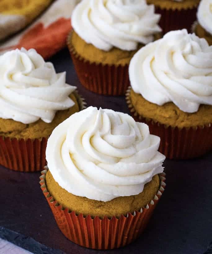 moist pumpkin cupcakes topped with boiled milk frosting