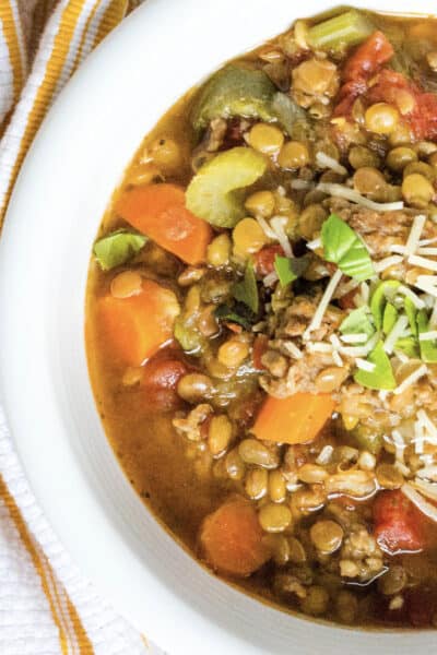 white bowl filled with Instant Pot Italian sausage and lentil soup