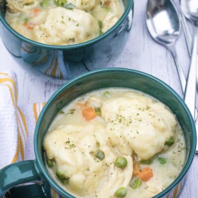 Easy chicken and Bisquick dumplings served in green soup mugs