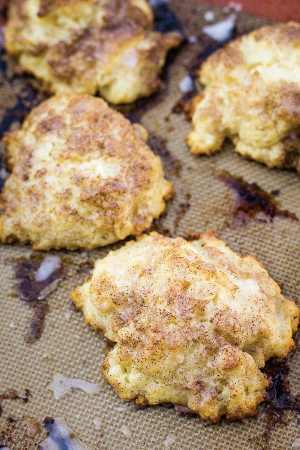 Cinnamon sugar drop biscuits on a silicone baking mat