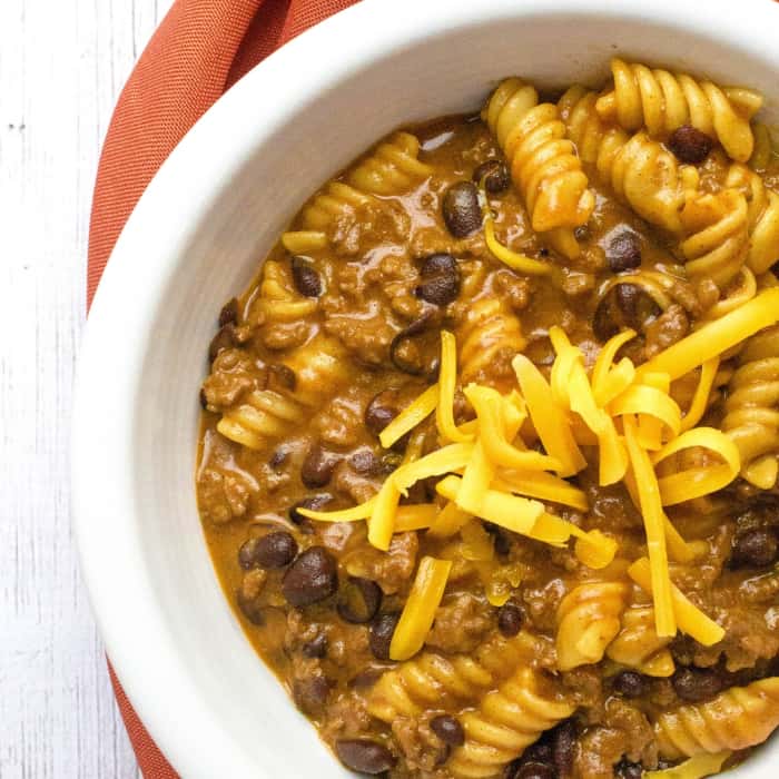 white bowl of beef enchilada pasta cooked in the Instant Pot, a great recipe for Instant Pot newbies