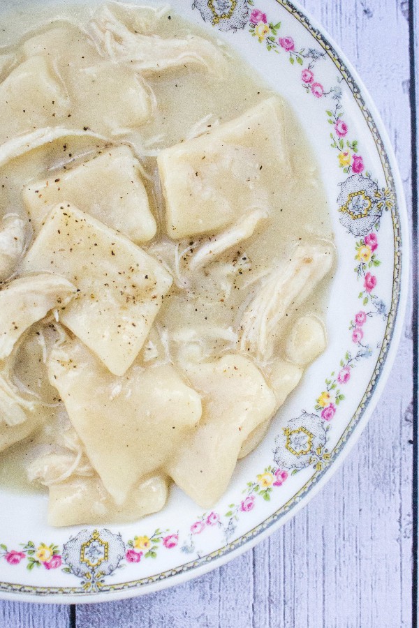 Floral China bowl filled with homemade southern style chicken and dumplings