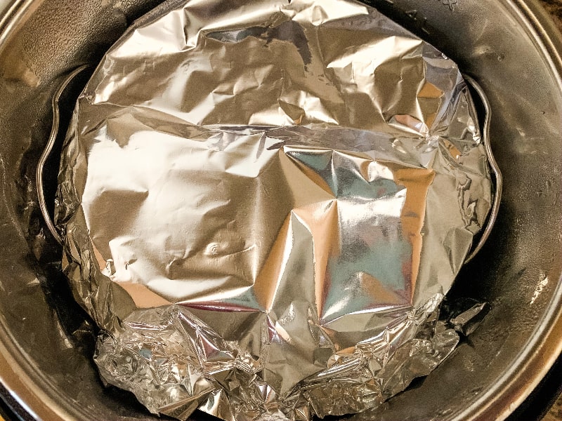 foil-covered dish of bread dough