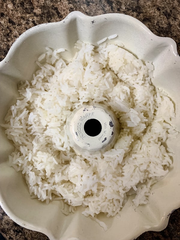 aluminum bundt pan containing cooked rice to be reheated in the Instant Pot