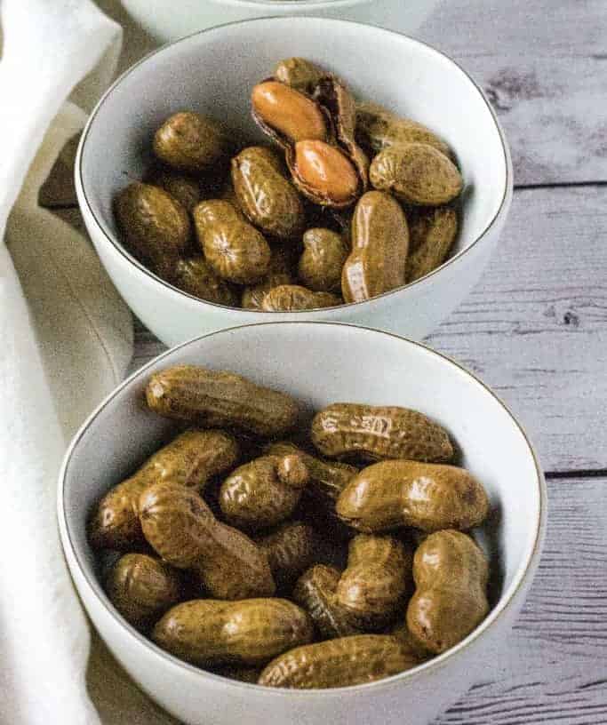two white bowls filled with Cajun boiled peanuts